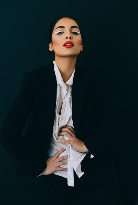 Woman Wearing Black Formal Suit Jacket Doing Pose